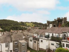 Houses with hilly background and castle ruins at 8 Watkin Street Conwy