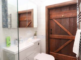 A bathroom with a sink and toilet at The Milking Shippon at Thorne, Langtree near Great Torrington