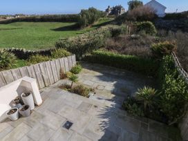 An outdoor space with paving stones and planters at 2 Lon Y Dryw, Trearddur Bay
