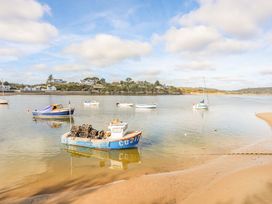 A view of boats at a beach near houses at Cilan - 2 Ty'n Don Llanengan near Abersoch