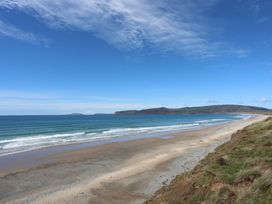 A beach with waves and cliffs at Oer - 8 Ty'n Don Llanengan near Abersoch