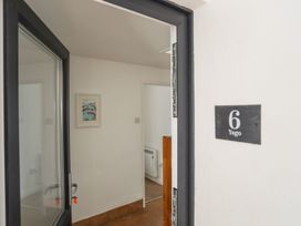 An entrance with door and number plate at Ysgo - 6 Ty'n Don in Abersoch