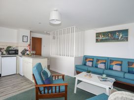 A living room with a couch and coffee table at Ysgo - 6 Ty'n Don, Abersoch
