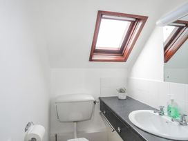 A bathroom with a sink and toilet at Ysgo - 6 Ty'n Don Abersoch