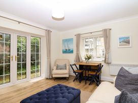 A living room with a dining table and seating area at 2 Sheplegh Court Blackawton near Dartmouth
