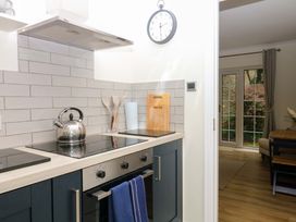 A kitchen with a kettle and cooktop at 2 Sheplegh Court near Dartmouth