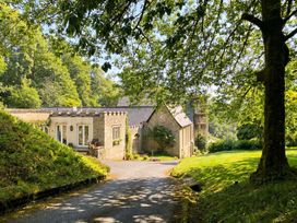 A house with a driveway and trees at 2 Sheplegh Court Blackawton near Dartmouth