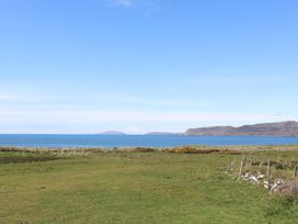 A coastal view with hills and sea at Towyn - 7 Ty'n Don