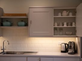 A kitchen with plumbing fixtures and storage at Old Manor Farm in Low Ham near Langport