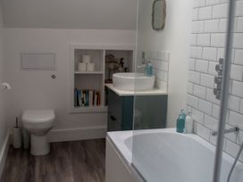 A bathroom with a bathtub and a toilet at The End in Low Ham near Langport
