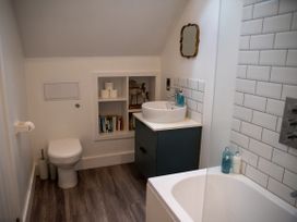 A bathroom with a sink and bathtub at The End Low Ham near Langport