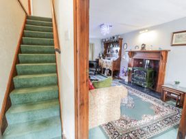 A living room with a sofa and fireplace at The Old Post Office in null