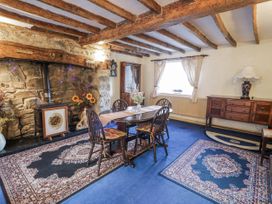 A dining room with a table and chairs at The Old Post Office in null