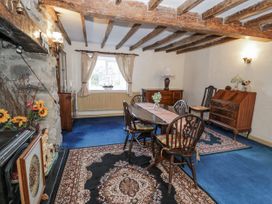 A dining room with a table and chairs at The Old Post Office in null