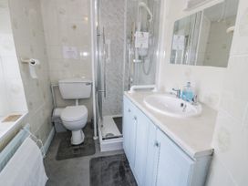 A bathroom with a toilet and shower at The Old Post Office in null