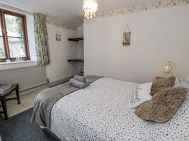 A bedroom with a bed and a window at The Old Post Office null
