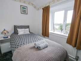 A bedroom with a bed and window at The Old Post Office null