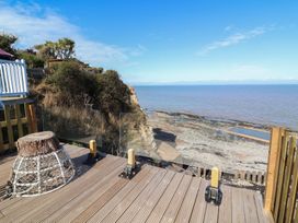 An outdoor area with decking and a view of the sea at Lenny's Place in Watchet