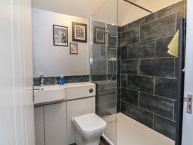 A bathroom with a shower and sink at Lenny's Place in Watchet