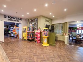 An entrance with games and candy dispenser at Mayfly Lodge in St Tudy