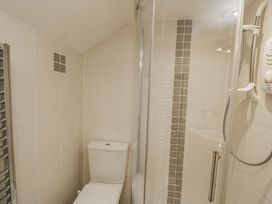 A bathroom with a shower and toilet at Shipwrights in Salcombe