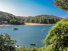 A coastal view with boats and trees at Shipwrights in Salcombe