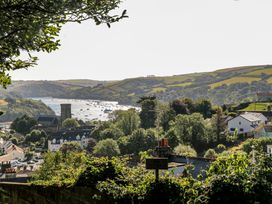 A view of a river with boats and houses at Shipwrights in Salcombe