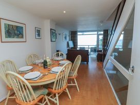 A dining area with a table and chairs at 20 Heath Court in Brixham