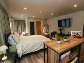 A bedroom with a bed and television at Cabin in 