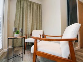 A living room with two chairs and a table at Cabin