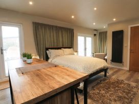 A bedroom with a bed and table at Cabin