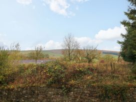 A view of hills and trees outside at Cabin