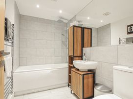 A bathroom with a bathtub and shower at The Dairy in 