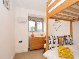 A bedroom with a bunk bed and a drawer unit at The Dairy in 