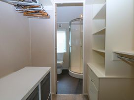 A bathroom with a shower and toilet at The Hideaway Pwllheli