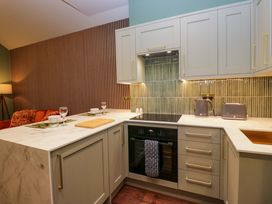 A kitchen with appliances and countertops at The Studio in Windermere