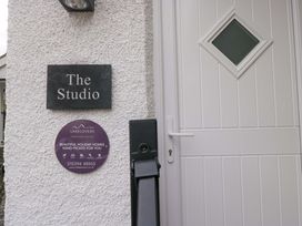 An entrance with a door and a name plaque at The Studio in Bowness-On-Windermere
