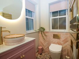 A bathroom with a sink and toilet at The Coach House in Windermere