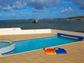 A swimming pool with towels nearby at 8 Thurlestone Rock in Kingsbridge