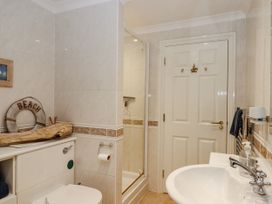 A bathroom with a shower and sink at 8 Thurlestone Rock in Kingsbridge