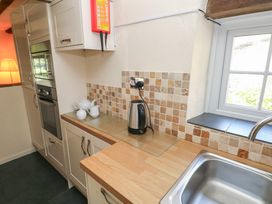 A kitchen with kettle and sink at Carthouse Cottage in Clarbeston Road