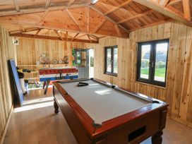 A games room with a pool table and foosball table at Knap Cottage in Clarbeston Road