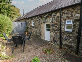 An outdoor area with a table and chairs at Stable Cottage in Clarbeston Road
