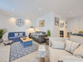 A living room with sofas and a coffee table at Number 2 Ellington Court Apartment in Torquay