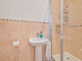A bathroom with a shower and sink at Number 2 Ellington Court Apartment in Torquay