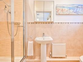 A bathroom with a shower and sink at Number 2 Ellington Court Apartment Torquay