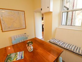 A dining room with a table and chairs at East View in Kirkby Stephen