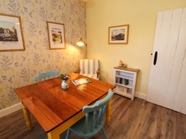 A dining room with a table and chairs at East View in Kirkby Stephen