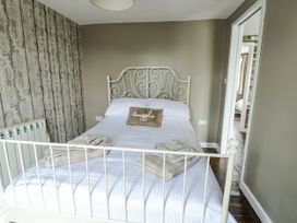 A bedroom with a bed and radiator at Harbour Lights Holyhead