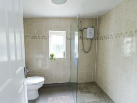 A bathroom with a shower and toilet at Harbour Lights in Holyhead